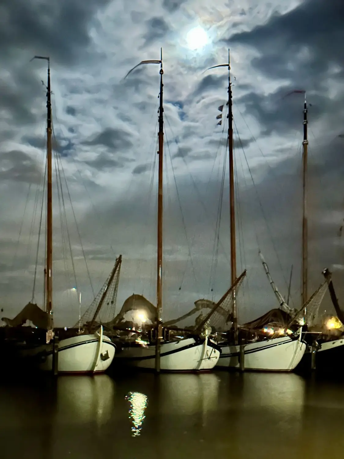 Successful Sailing - Boats in the sea at night