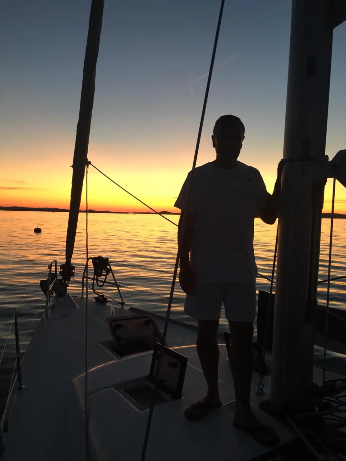Successful Sailing - Skipper Thomas Lindloff sailing on the sea on sunset