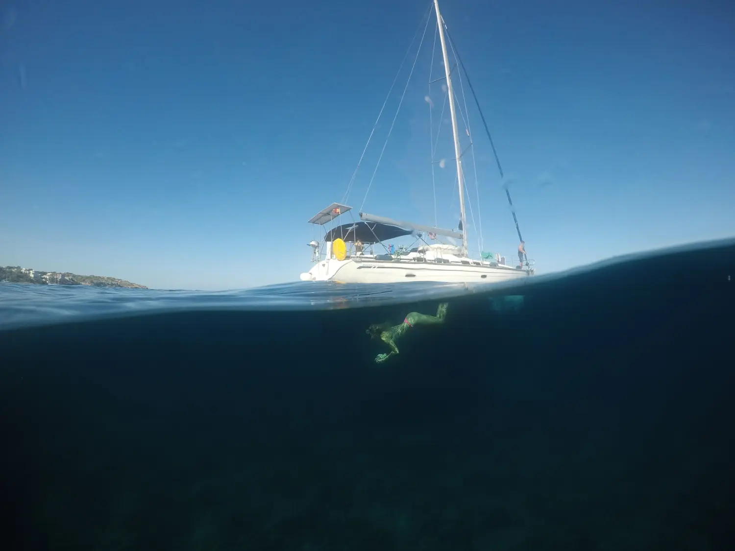 Successful Sailing - boat sailing in the sea, underwater diving