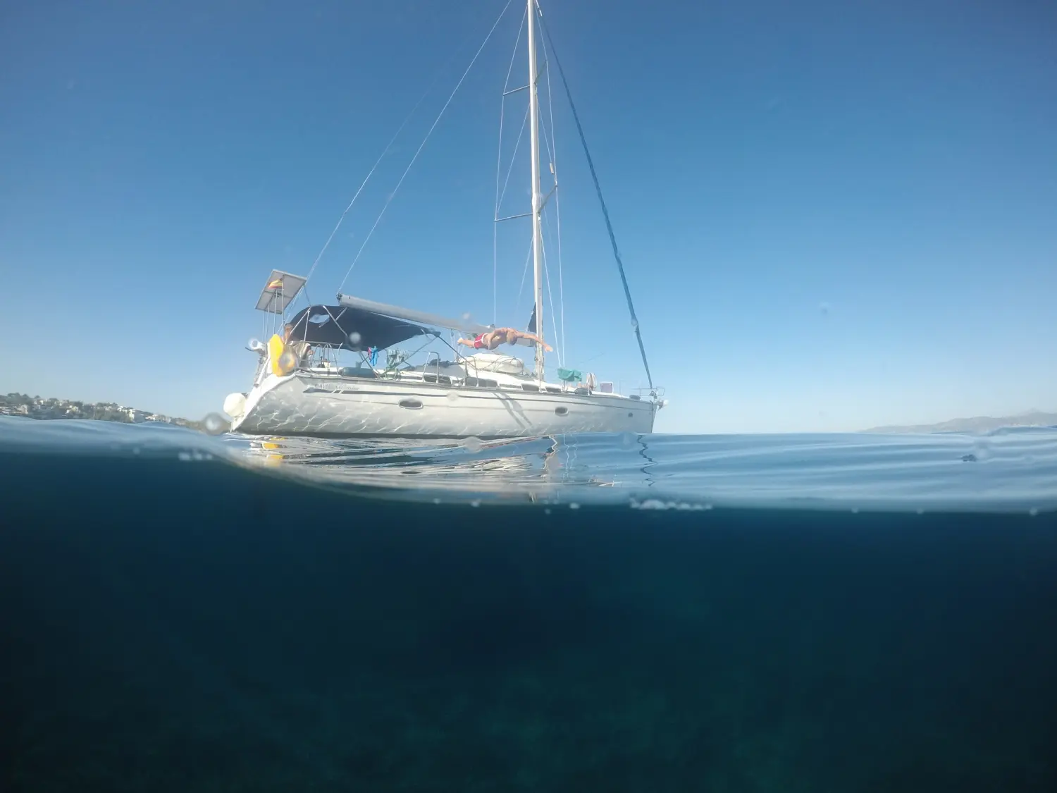 Successful Sailing - boat sailing in the sea, underwater diving